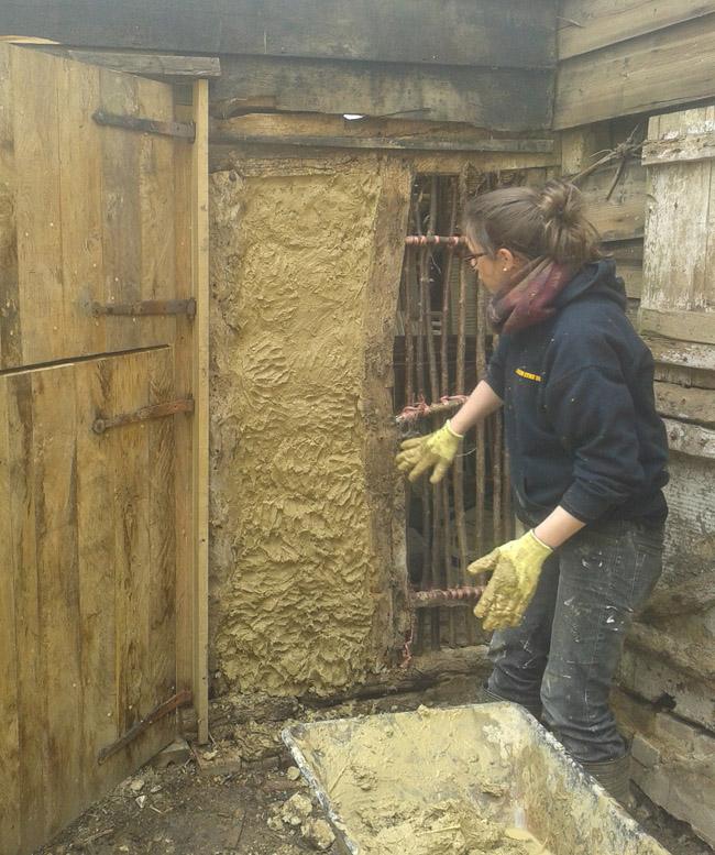 Learn how to apply homemade daub to wattle panel