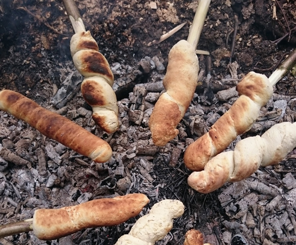 Bread twists cooked over wood fire